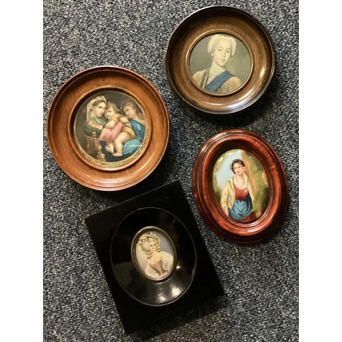 945 - A collection of four oval miniatures. Est. £20 - £30.