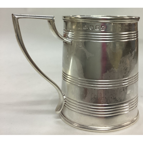 95 - A George III silver reeded tankard. London 1801. By John Emes. Approx. 164 grams. Est. £150 - £200.