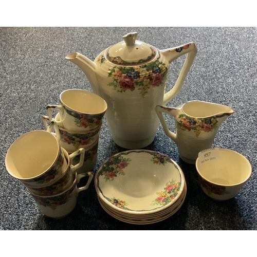 957 - A Crown Ducal coffee service decorated with bright colours. Est. £40 - £60.