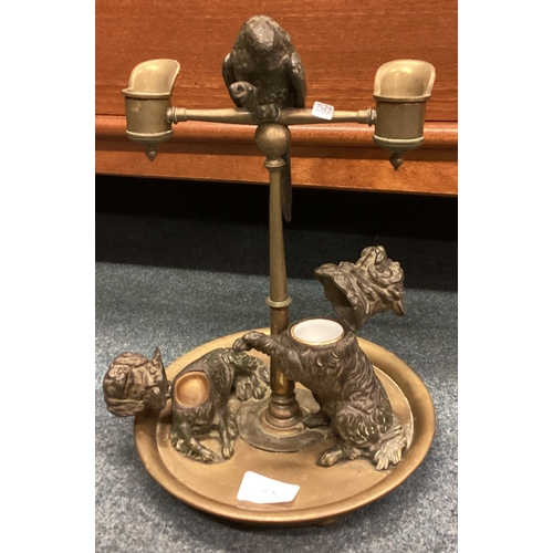 978 - A good quality bronze candelabra attractively decorated with a parrot together with a pair of dogs m... 