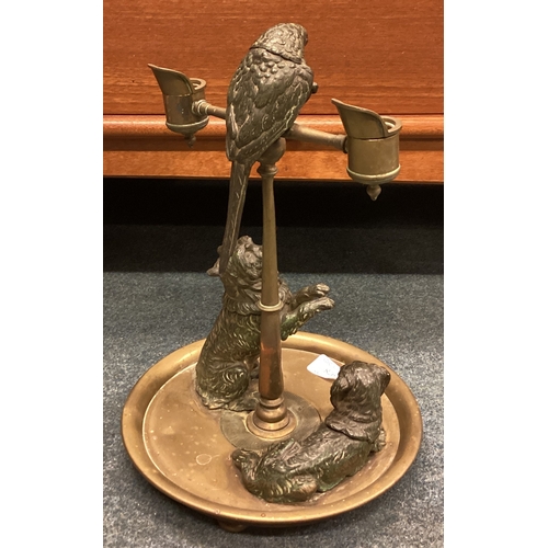 978 - A good quality bronze candelabra attractively decorated with a parrot together with a pair of dogs m... 