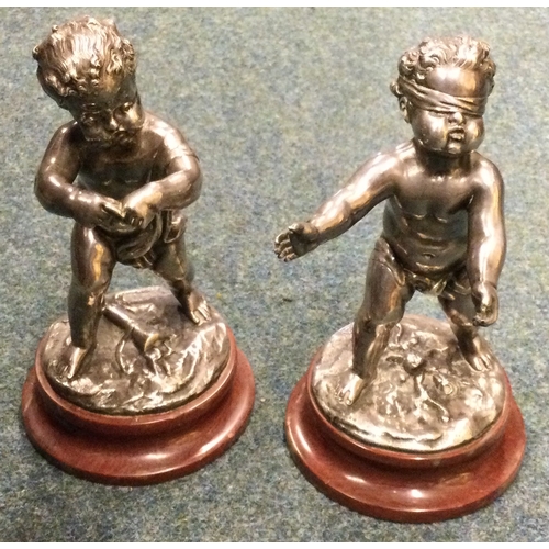 981 - LOUIS KLEY: (French, 1833 - 1911): A pair of silvered bronze children on circular marble socles. Sig... 