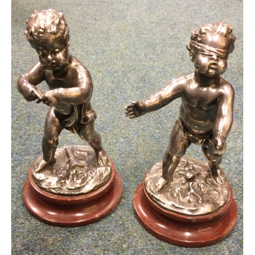 981 - LOUIS KLEY: (French, 1833 - 1911): A pair of silvered bronze children on circular marble socles. Sig... 