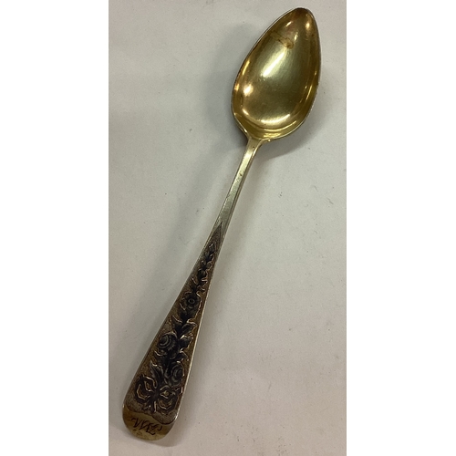 99 - An early 19th Century silver gilt spoon engraved with scenes. Marked to end. Approx. 139 grams. Est.... 