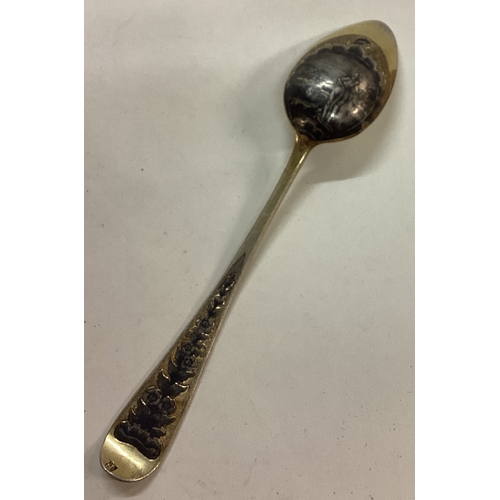 99 - An early 19th Century silver gilt spoon engraved with scenes. Marked to end. Approx. 139 grams. Est.... 