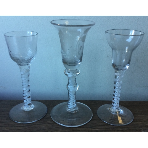 992 - Three good Georgian air-twist glasses of typical form to pedestal base. Est. £80 - £120.