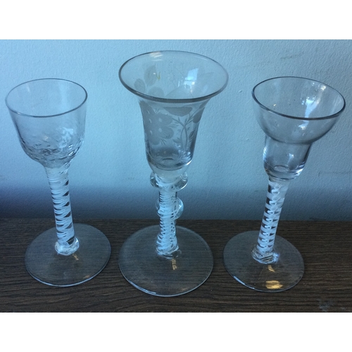 992 - Three good Georgian air-twist glasses of typical form to pedestal base. Est. £80 - £120.