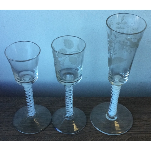 993 - Three good Georgian air-twist glasses of typical form to pedestal base. Est. £80 - £120.