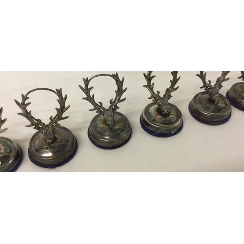 473 - A set of six silver menu holders decorated with hunting scenes. Birmingham 1913. By A&L Ltd. Approx.... 