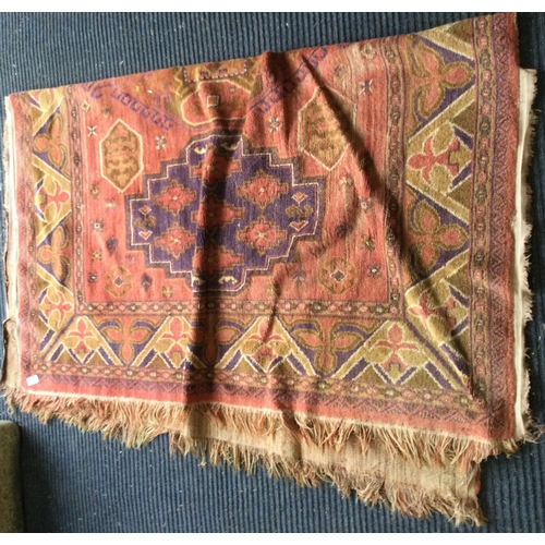 1668 - A good tapestry rug decorated in bright colours. Approx. 167 cms x 140 cms. Est. £30 - £40.