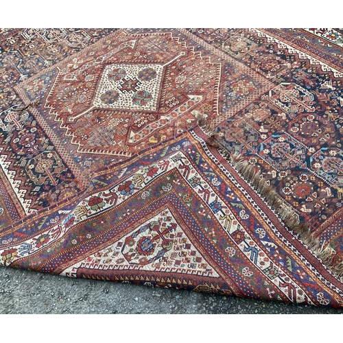 1671 - A good Oriental ground carpet / rug decorated in bright colours. Approx. 205 cms x 280 cms. Est. £80... 