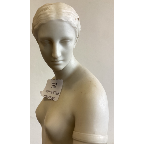 762 - A tall alabaster figure of a lady. Est. £30 - £40.