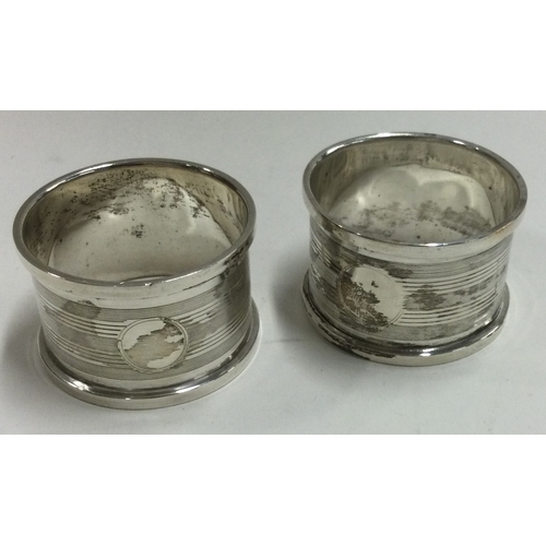 118 - A good pair of engine turned silver napkin rings. Birmingham. Approx. 35 grams. Est. £20 - £30.