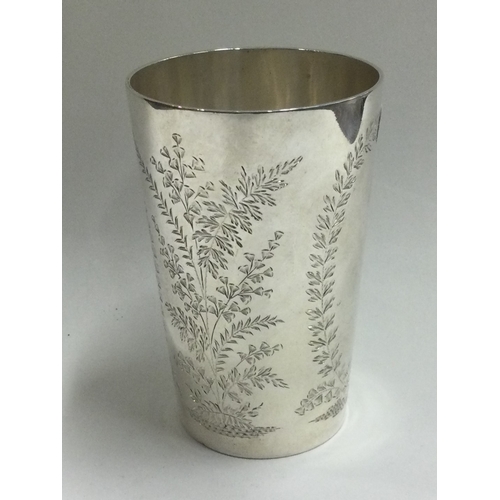 132 - A Victorian silver goblet with engraved decoration. London 1874. Approx. 84 grams. Est. £200 - £300.