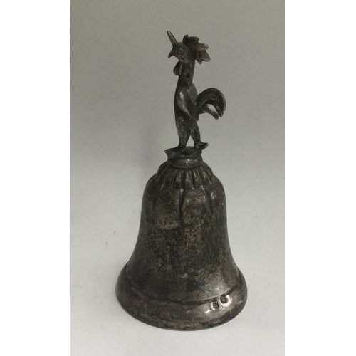 134 - A Continental silver bell with cockerel finial. Approx. 59 grams. Est. £80 - £120.