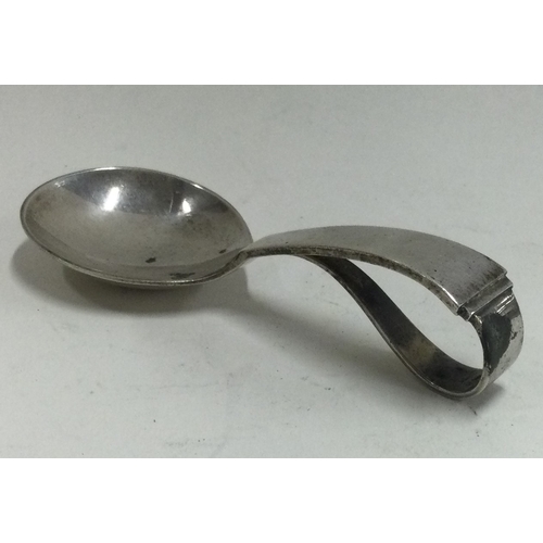 151 - GEORG JENSEN: A silver caddy spoon of typical design bearing import marks. Approx. 28 grams. Est. £5... 