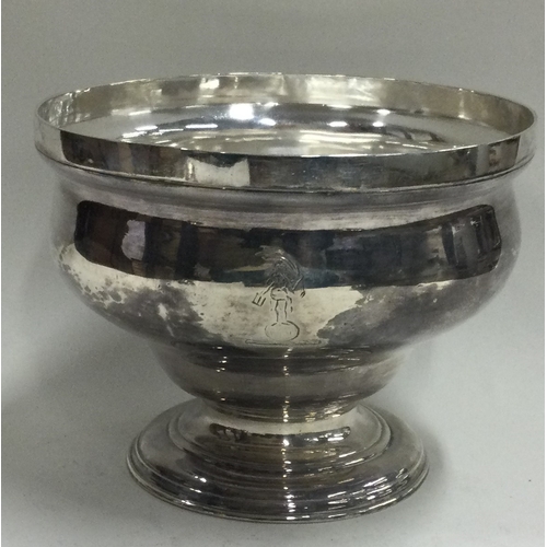 152 - An early 18th Century silver crested bowl. London 1752. Approx. 209 grams. Est. £300 - £500.