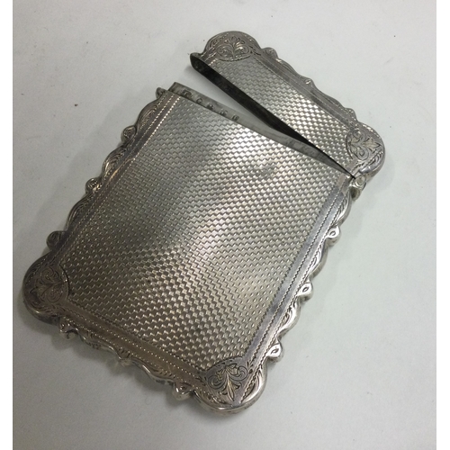 153 - A Victorian silver card case with engine turned decoration. Birmingham 1864. By John Tongue. Approx.... 