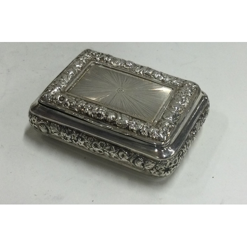 154 - A chased George III silver snuff box with bright cut decoration. Birmingham 1817. By Joseph Willmore... 