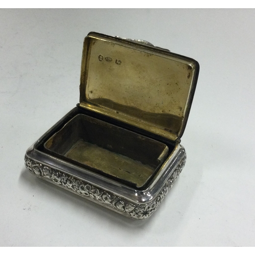 154 - A chased George III silver snuff box with bright cut decoration. Birmingham 1817. By Joseph Willmore... 