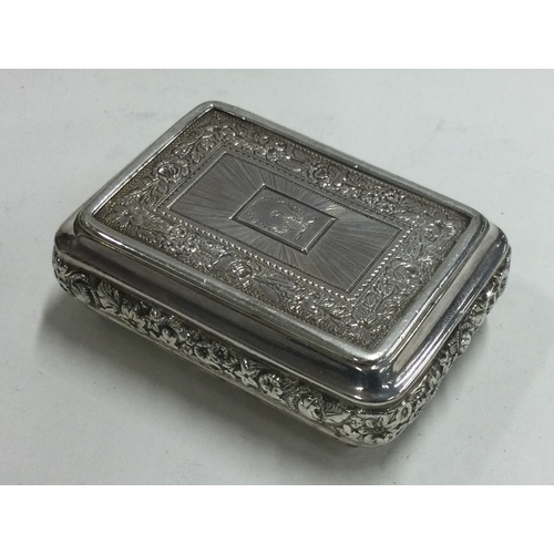 154 - A chased George III silver snuff box with bright cut decoration. Birmingham 1817. By Joseph Willmore... 