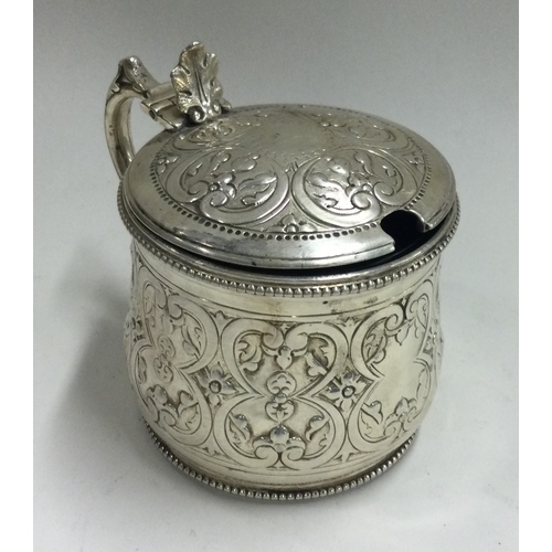 157 - A Victorian silver and glass mustard pot. London 1876. By George Angell. Approx. 145 grams. Est. £10... 