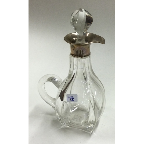 178 - A silver mounted glass whisky decanter. Birmingham 1907. Approx. 186 grams of gross weight. Est. £30... 