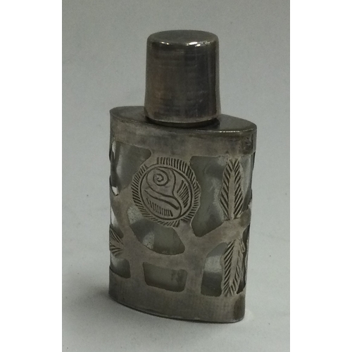 179 - A silver mounted glass scent bottle. Marked to base. Est. £20 - £30.