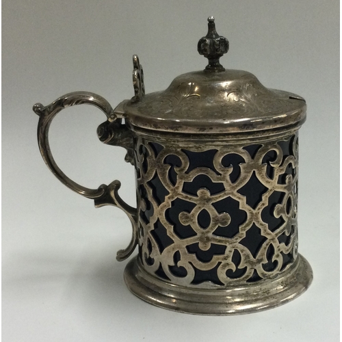 180 - A pierced Victorian silver and glass mustard pot. London 1860. By John Emes. Approx. 144 grams. Est.... 