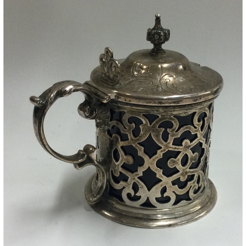 180 - A pierced Victorian silver and glass mustard pot. London 1860. By John Emes. Approx. 144 grams. Est.... 