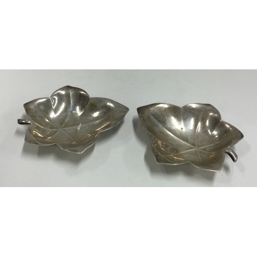 182 - TIFFANY & CO: A pair of silver leaf dishes. Approx. 78 grams. Est. £100 - £150.