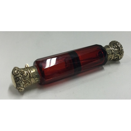 183 - A silver gilt and red glass double scent bottle. Est. £100 - £150.