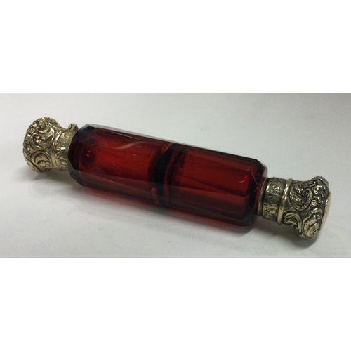 183 - A silver gilt and red glass double scent bottle. Est. £100 - £150.