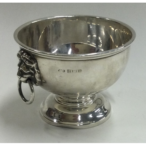 186 - A silver Monteith bowl with lion mask handles. Birmingham. Approx. 75 grams. Est. £50 - £80.