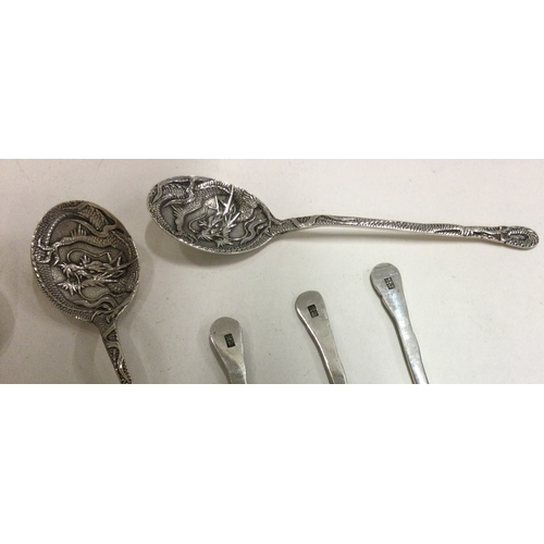 203 - A collection of six Continental silver coffee spoons with dragon decoration. Punched to backs. Appro... 