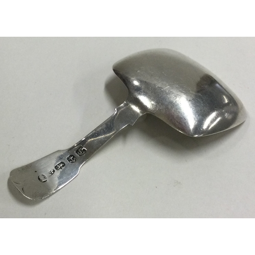 216 - A George III plain silver caddy spoon. Birmingham 1828. Approx. 10 grams. Est. £50 - £80.