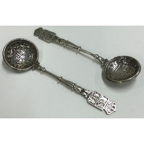 223 - A pair of early Antique Spanish silver spoons set with coins. Approx. 74 grams. Est. £80 - £120.