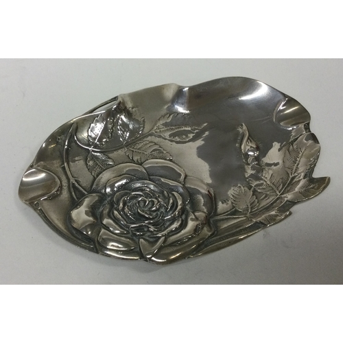 228 - A novelty silver dish embossed with flowers and engraved with vines. Marked to interior. Approx. 125... 