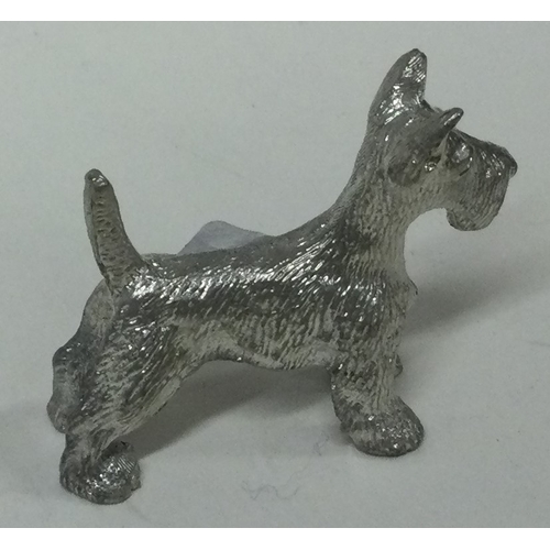 232 - A silver plated figure of a dog. Marked, 'OMM'. Est. £10 - £20.