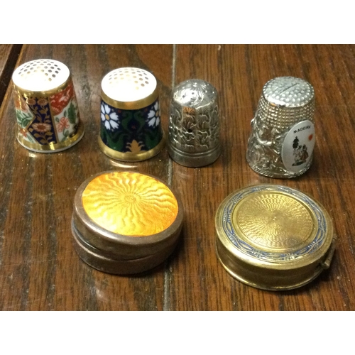 233 - A collection of four bone china thimbles together with a silver plated enamelled box. Est. £30 - £50... 