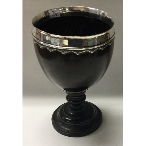 252 - An 18th Century silver mounted coconut cup. Approx. 161 grams of gross weight. Est. £200 - £300.