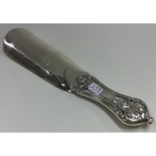 255 - A heavy American silver letter opener with chased decoration. Approx. 77 grams. Est. £130 - £150.