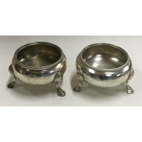 260 - A pair of heavy Victorian silver salts with crested fronts. London. Approx. 114 grams. Est. £50 - £8... 