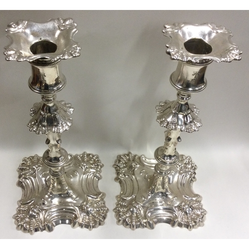 262 - A heavy pair of cast silver candlesticks of typical form. London 1767. Approx. 1217 grams. Est. £700... 