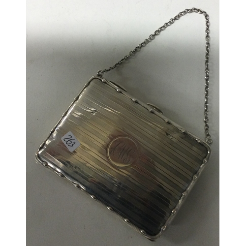 263 - A silver card case with suspension chain. Birmingham 1916. Approx. 130 grams. Est. £80 - £120.