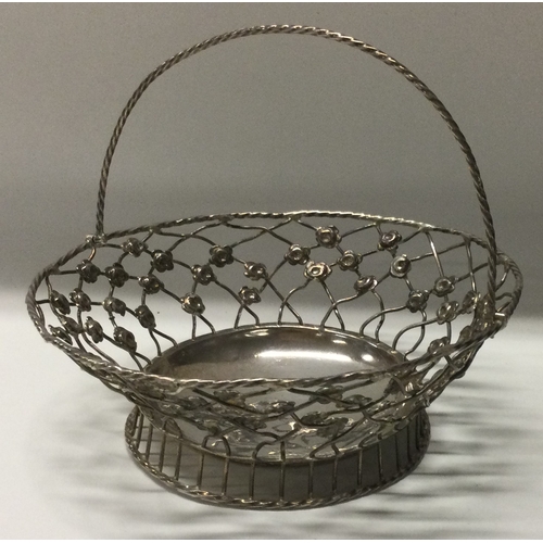 270 - An 18th Century silver swing handled pierced basket. London 1766. Approx. 85 grams. Est. £100 - £150... 