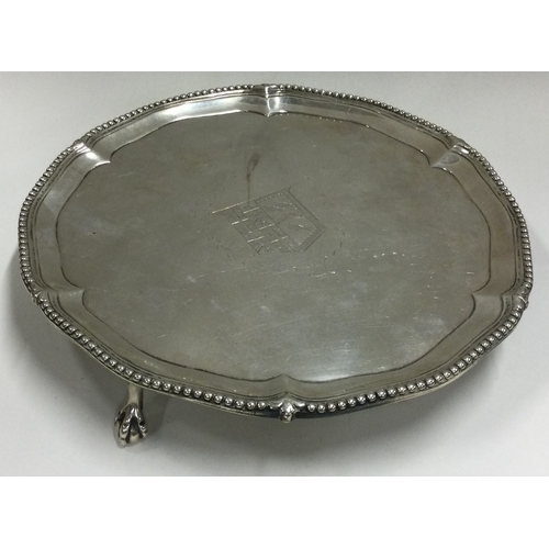 279 - A heavy 18th Century silver salver with central armorial. London 1773. By John Carter. Approx. 422 g... 