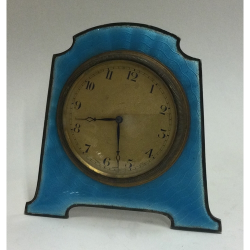 28 - A silver and blue enamelled clock. Approx. 167 grams. Est. £100 - £150.