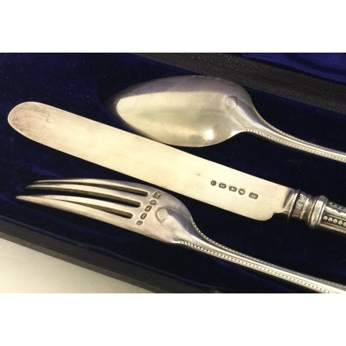 280 - A cased Victorian silver three piece christening set. Approx. 115 grams. Est. £80 - £120.