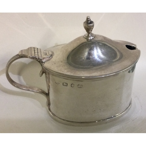 281 - A silver and glass mustard pot. Birmingham 1893. Approx. 70 grams. Est. £50 - £80.